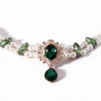 Green gemstone pendant necklace detail