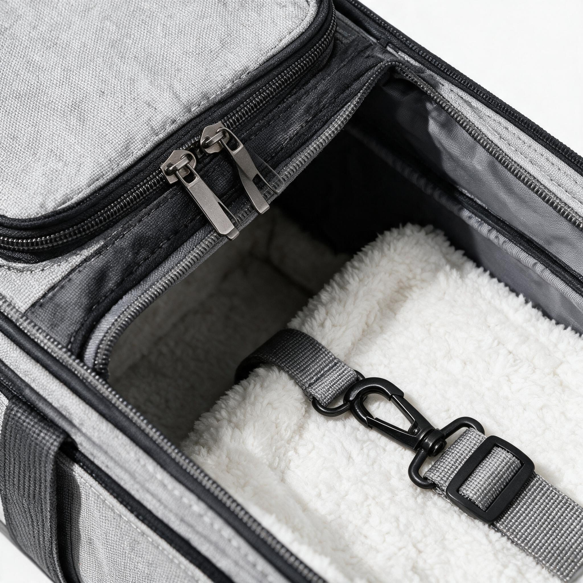 Pet carrier opening zipper and strap details