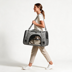Woman carrying a cat in the Annapaws pet travel carrier